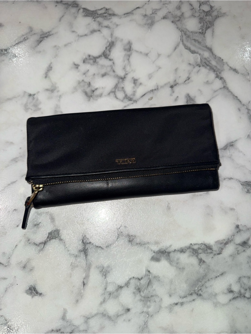 Tumi Black nylon and leather wallet with gold fixtures